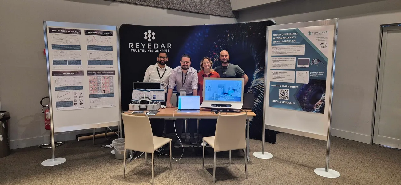 The Reyedar team at the EUNOS 2026 stand in Milan, between the four posters and the SONDA demo table